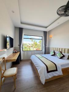 En eller flere senge i et værelse på Mộc Thạch Homestay Gia Lai