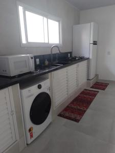 Kuchyň nebo kuchyňský kout v ubytování Lar Armação