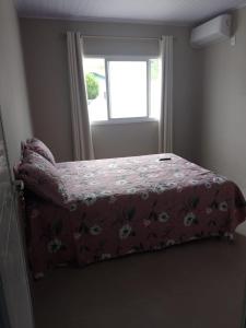 Postel nebo postele na pokoji v ubytování Lar Armação