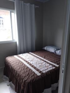 Postel nebo postele na pokoji v ubytování Lar Armação