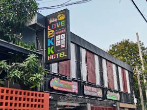 a building with a sign on the side of it at โรงแรม เลิฟ บีเคเค in Amphoe Phra Khanong