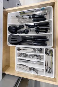 a drawer filled with utensils in a kitchen at Vancouver Cozy Cove in Vancouver