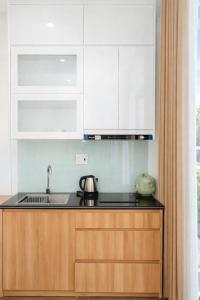 Kuchyň nebo kuchyňský kout v ubytování TD Apartment + 30 fotografií