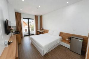 Postel nebo postele na pokoji v ubytování TD Apartment