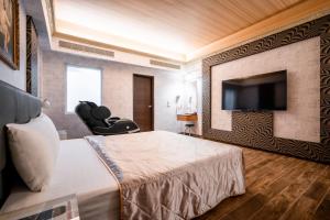 Et tv og/eller underholdning på Holland Village Motel