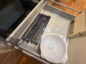 an open appliance with a fan in a refrigerator at 最大10名 源泉掛け流し露天風呂付き一棟貸しNagasima Private Villa in Genroku +27 photos