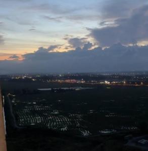 an aerial view of a city at sunset at AbahHomeStudio Tunjung in Kota Bharu +6 photos