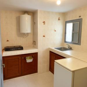 a kitchen with a sink and a counter top at Entire Guesthouse with Private Rooftop in Taghazout