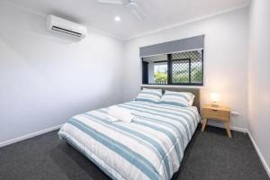 En eller flere senge i et værelse på Getaway on the Green in Townsville