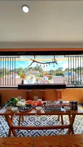a large window with a table with food on it at Gin House Đà Lạt in Da Lat