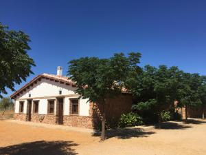 a white house with trees in front of it at Casa del Fraile in Villarrobledo
