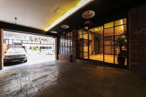 a garage with a car parked outside of a building at The Lime Hotel in Incheon