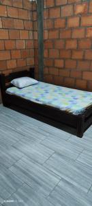 Giường trong phòng chung tại Apartamento Lago Calima