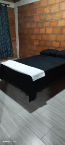 Giường trong phòng chung tại Apartamento Lago Calima