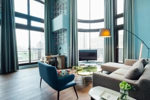 a living room with a couch and a table at Chez Nous in Taipei