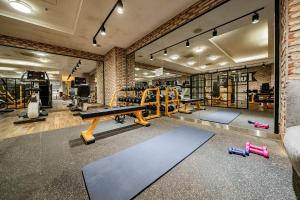 a gym with tread machines and a ping pong table at Raum Hotel in Seoul