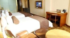 TV a/nebo společenská místnost v ubytování James Joyce Coffetel Baoding Railway Station + 19 fotografií