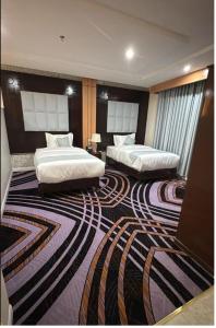 Giường trong phòng chung tại هورايزون بلص