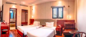 Postel nebo postele na pokoji v ubytování Bon Ami Hotel - Thiên Xuân Hotel + 48 fotografií