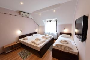 Postel nebo postele na pokoji v ubytování Apartments & Accommodation Stojic
