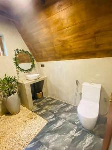 a bathroom with a toilet and a sink at Syara villa in Unawatuna
