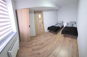 En eller flere senge i et værelse på ApartHotel11