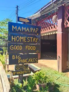 a sign for ahmaraapaapa homesteadery with a sign for at Mama Pap - Tad Lo in Ban Donkhagnoung