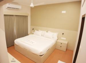 En eller flere senge i et værelse på Hotel Spacio