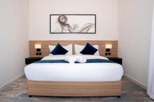 Postel nebo postele na pokoji v ubytování ارجان بارك الحمراء