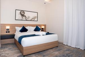 Postel nebo postele na pokoji v ubytování ارجان بارك الحمراء