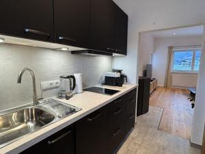 Kuchyň nebo kuchyňský kout v ubytování Lucy s Studio Apartment Kössen + 7 fotografií