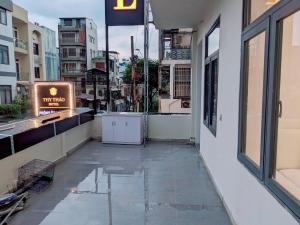 a walkway outside a building with a sign on it at Khách sạn Thy Thảo 3 in Ho Chi Minh City