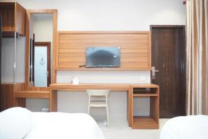 Et tv og/eller underholdning på Sinok Homestay Parapat