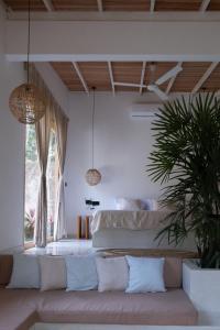 En eller flere senge i et værelse på Kiki Studios