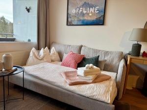 En eller flere senge i et værelse på Bergzeit Apartments