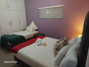 En eller flere senge i et værelse på Clearview Estuary Apartment 3