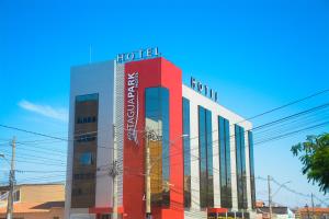 a hotel building with a hotel sign on top of it at TaguaPark Hotel in Taguatinga