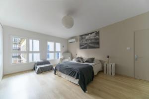 Postel nebo postele na pokoji v ubytování Maison Russie - Grande maison climatisée avec parking centre ville