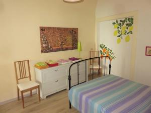 A bed or beds in a room at Tra Amalfi, Pompei, Paestum