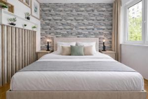 Giường trong phòng chung tại Comfort 14 Stylish City Apartment