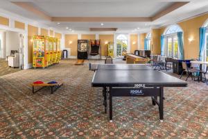 a ping pong table in the middle of a room at Coconut Malorie Resort Ocean City, Ascend Collection Hotel in Ocean City