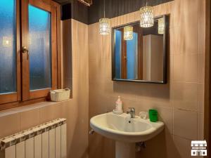 a bathroom with a sink and a mirror at THE LOFT by Design Studio in Bellano +32 photos