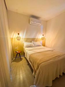 En eller flere senge i et værelse på Casa Vista Mar - Praia do Frances