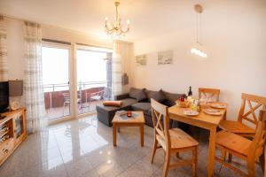 a living room with a couch and a table at Schnuckeliges Appartement in Sankt Andreasberg
