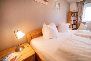 Postel nebo postele na pokoji v ubytování Schnuckeliges Appartement