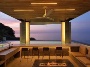 an outdoor bar with a view of the ocean at KONA RESORT AWAJI KAI in Awaji +35 photos