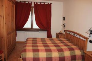 Posteľ alebo postele v izbe v ubytovaní Chalet Alberti