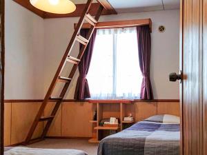 En eller flere senge i et værelse på Pension Noel