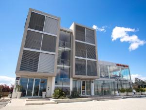 an office building with a lot of windows at Hotel I Crespi in Grosseto