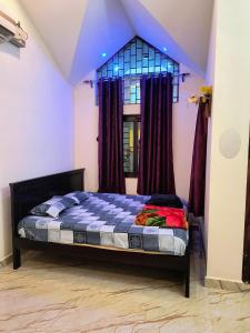 En eller flere senge i et værelse på Twilight Home stay